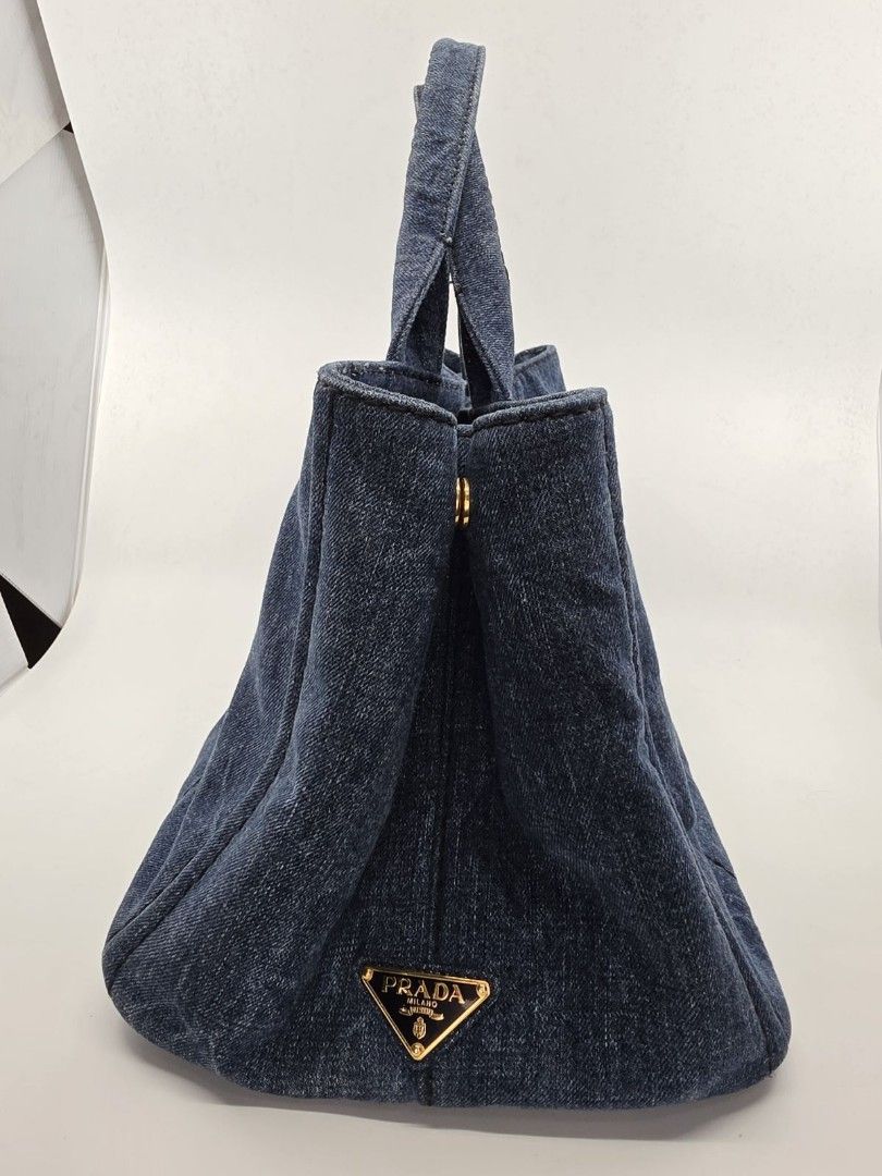 PRADA CANAPA DENIM (Category: Luxury Bags & Wallets) located in Quezon City. Submitted by nadine_miel (Listing ID 1446029672, Image 2). Description: Prada Canapa denim medium size w/ adjustble long strap in excellent condition send us pm for detailed photo for only 28k.