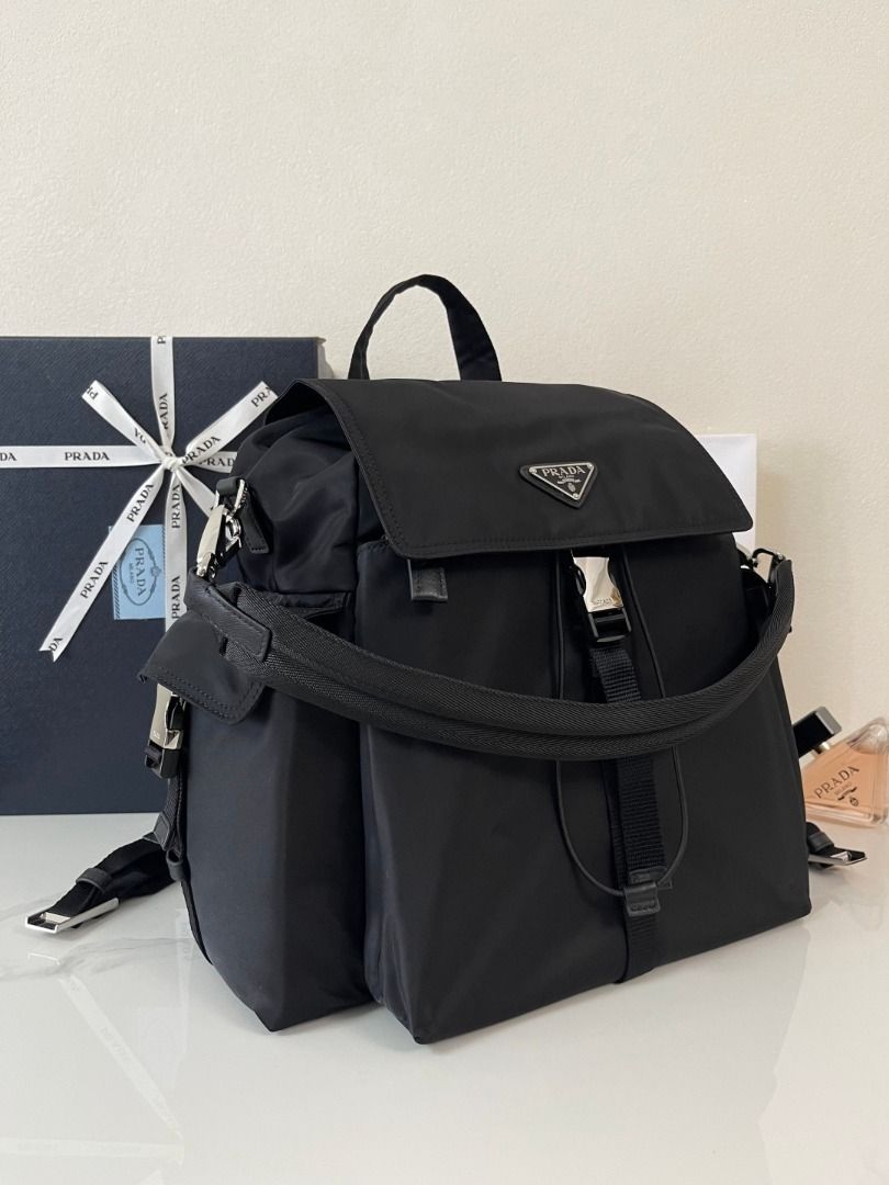Prada Nylon Backpack Black Silver Buckle (Category: Luxury Bags & Wallets) located in Marikina City. Submitted by ahmetgrudd69522 (Listing ID 1446051969, Image 3). Description: - Classic Prada backpack in black nylon - Iconic silver triangle logo - Secure drawstring closure with buckle flap - Multiple pockets for organization - Adjustable shoulder straps - Ideal for daily use or travel.