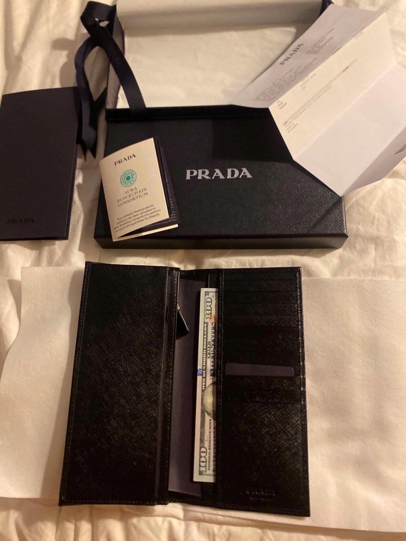 Prada Saffiano Leather Long Wallet Black (Category: Luxury Bags & Wallets) located in Quezon City. Submitted by Daichy (Listing ID 1446118576, Image 2). Description: - Authentic Prada Long Wallet - Material: Black Saffiano Leather - Includes: Original Box, Dust Bag, Authenticity Card, Receipt - Features: Multiple Card Slots, Zip Compartment - Purchased from: Prada Doha Place Vendome.