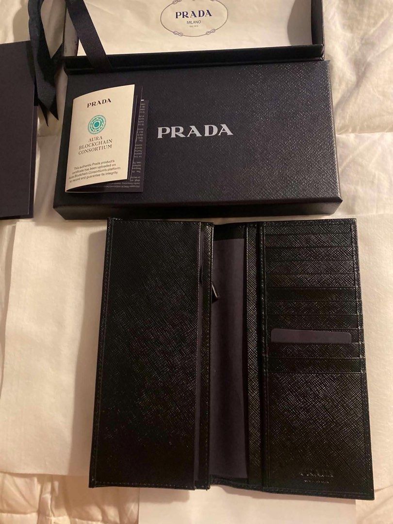 Prada Saffiano Leather Long Wallet Black (Category: Luxury Bags & Wallets) located in Quezon City. Submitted by Daichy (Listing ID 1446118576, Image 3). Description: - Authentic Prada Long Wallet - Material: Black Saffiano Leather - Includes: Original Box, Dust Bag, Authenticity Card, Receipt - Features: Multiple Card Slots, Zip Compartment - Purchased from: Prada Doha Place Vendome.