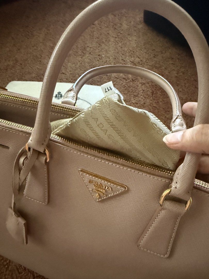 Prada Saffiano Lux Tote Bag (Category: Luxury Bags & Wallets) located in Bulacan. Submitted by rc_retailing (Listing ID 1446007351, Image 2). Description: - Authentic Prada Saffiano Lux Tote - Color: Light Pink - Hardware: Gold - Includes: Dust Bag - Features: Spacious interior, smooth zippers - Versatile: Ideal for daily use or special occasions - Classic Prada design.