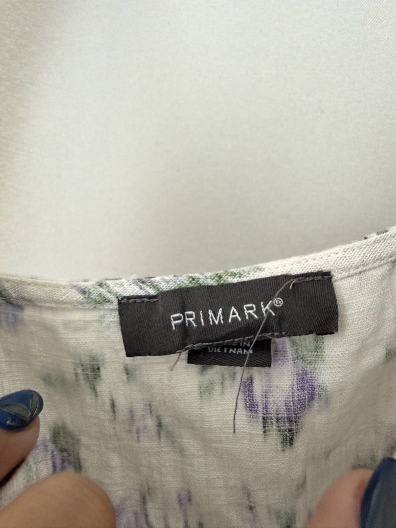 Primark White Floral Midi Dress (Category: Dresses) located in Cainta. Submitted by m4rie_ (Listing ID 1445995992, Image 3). Description: Used once only. Best fits: M-L RFS: Decluttering Details about this dress: - Pre-loved - White midi dress - Purple floral print - Spaghetti straps - Sweetheart neckline - Side slit - Ideal for summer outings or casual wear - Comfortable and lightweight fabric.