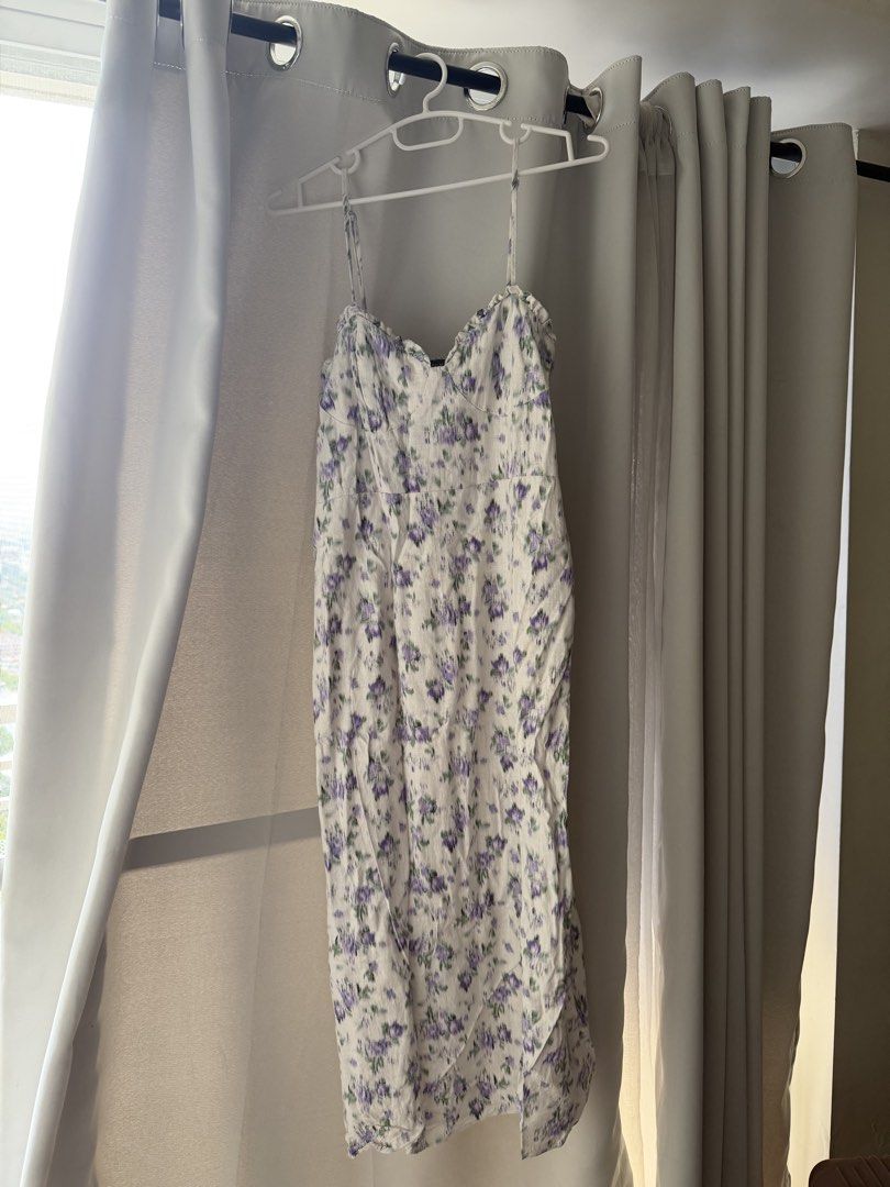 Primark White Floral Midi Dress (Category: Dresses) located in Cainta. Submitted by m4rie_ (Listing ID 1445995992, Image 1). Description: Used once only. Best fits: M-L RFS: Decluttering Details about this dress: - Pre-loved - White midi dress - Purple floral print - Spaghetti straps - Sweetheart neckline - Side slit - Ideal for summer outings or casual wear - Comfortable and lightweight fabric.