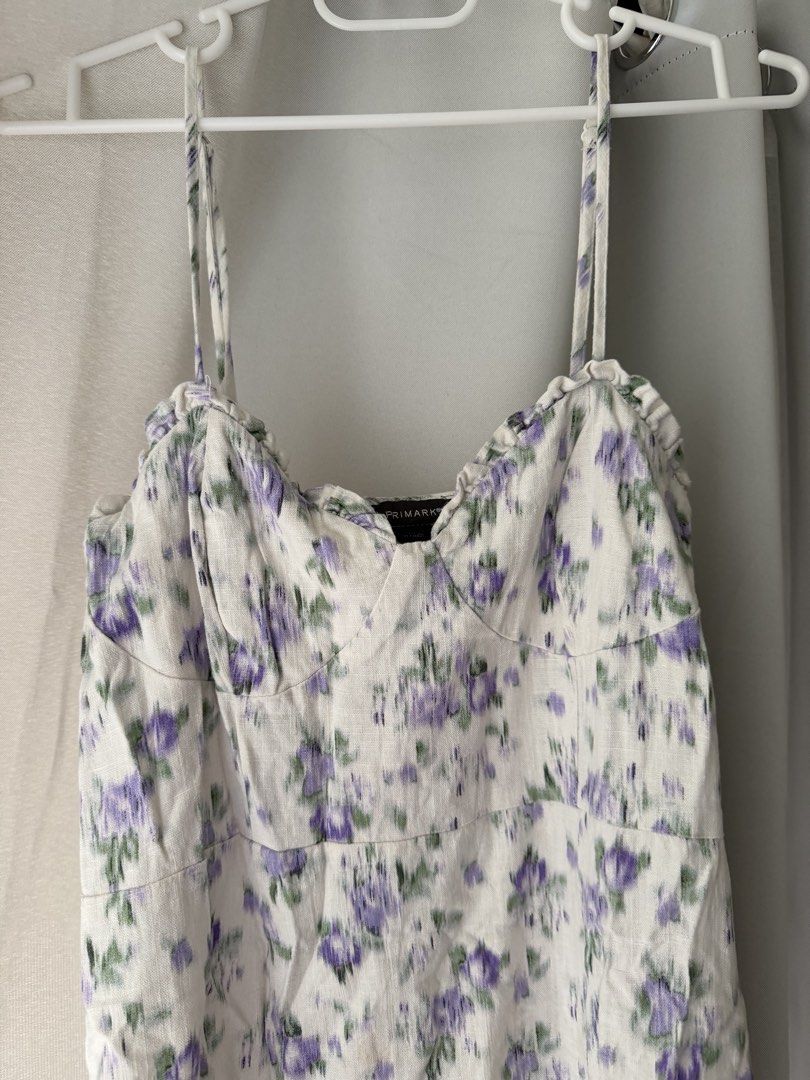 Primark White Floral Midi Dress (Category: Dresses) located in Cainta. Submitted by m4rie_ (Listing ID 1445995992, Image 2). Description: Used once only. Best fits: M-L RFS: Decluttering Details about this dress: - Pre-loved - White midi dress - Purple floral print - Spaghetti straps - Sweetheart neckline - Side slit - Ideal for summer outings or casual wear - Comfortable and lightweight fabric.