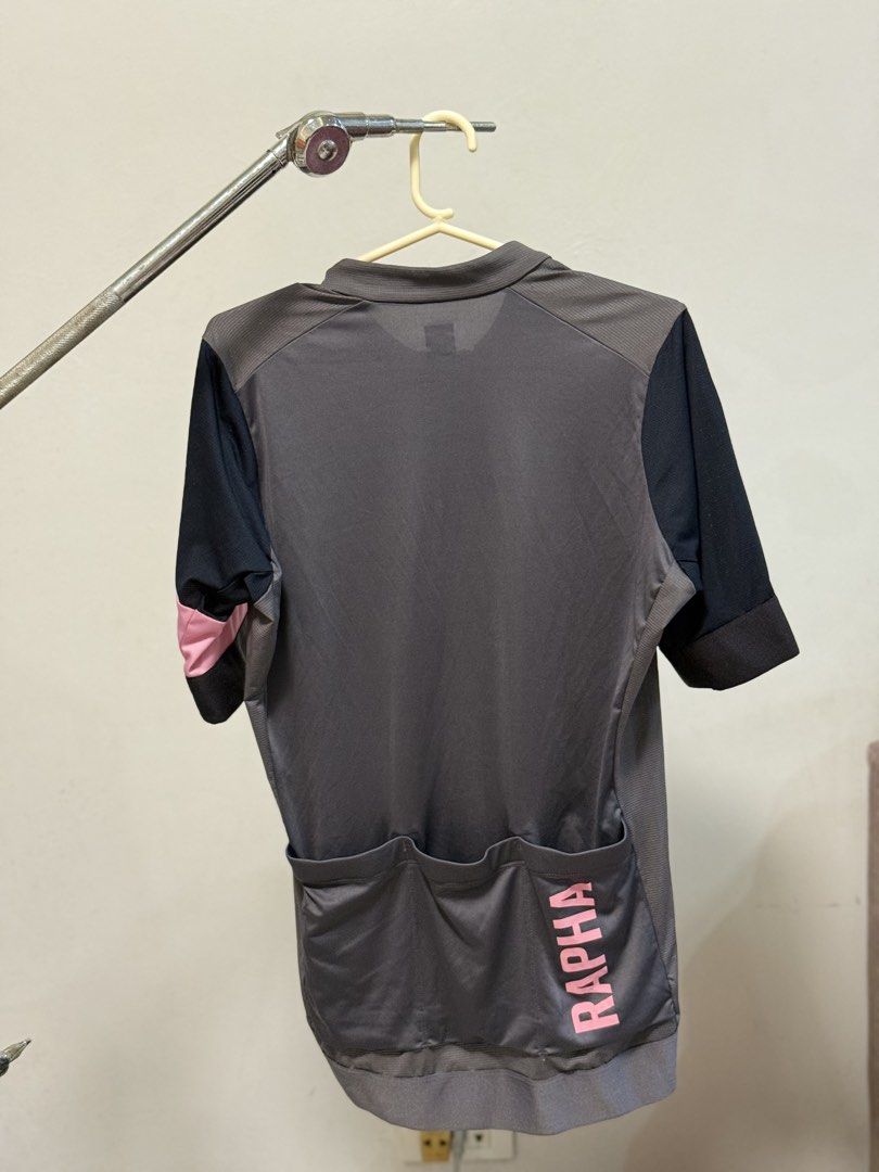Rapha Cycling Jersey - Grey/Black/Pink - Size Medium (Category: Activewear) located in Caloocan City. Submitted by thebikebin (Listing ID 1446037052, Image 1). Description: - Rapha cycling jersey - Color: Grey body, black sleeves, pink accents - Features: Full zip front, 3 back pockets with Rapha logo - Size: Medium - Perfect for your next cycling adventure!.