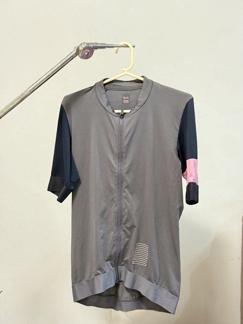 Rapha Cycling Jersey - Grey/Black/Pink - Size Medium (Category: Activewear) located in Caloocan City. Submitted by thebikebin (Listing ID 1446037052, Image 3). Description: - Rapha cycling jersey - Color: Grey body, black sleeves, pink accents - Features: Full zip front, 3 back pockets with Rapha logo - Size: Medium - Perfect for your next cycling adventure!.