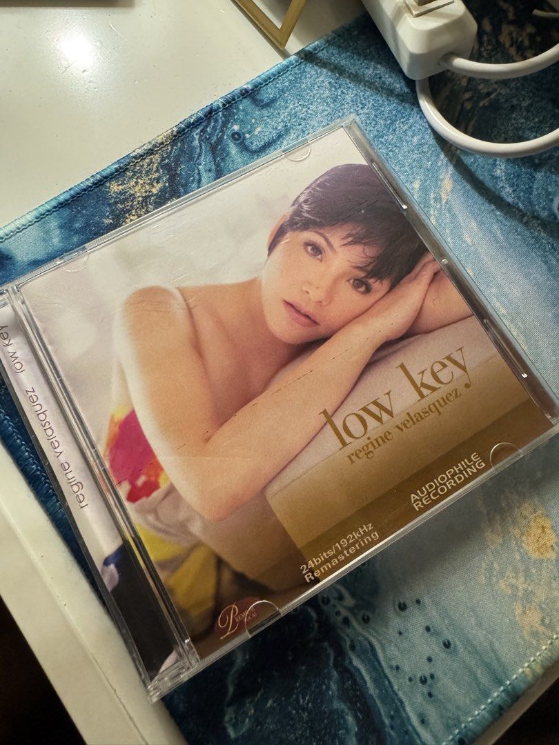Regine Velasquez Low Key Fan Made CD (Category: CDs & DVDs) located in Manila. Submitted by markdarwin18477 (Listing ID 1446116929, Image 1). Description: - Regine Velasquez 'Low Key' Album - Audiophile Recording - Remastered at 24bits/192kHz for superior sound quality - Includes all 17 original tracks plus a bonus track - Released by Universal Records in 2008 - Perfect for music enthusiasts and collectors.