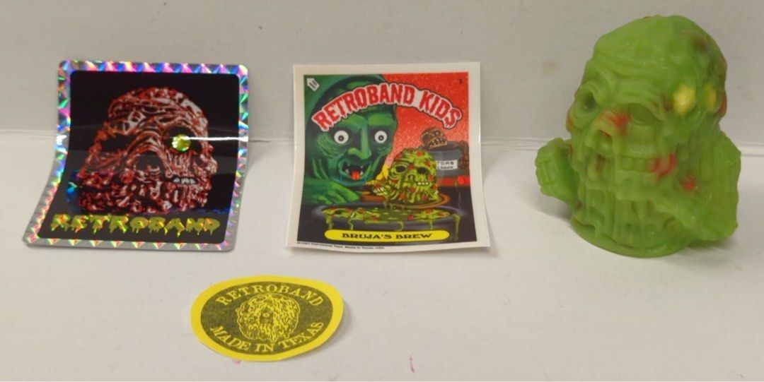 Retroband Ma-Ba Sewer Suffer Figure 7cm (Category: Designer & Blind Box Toys) located in Quezon City. Submitted by jmp923 (Listing ID 1446027520, Image 3). Description: - Authentic Retroband Sewer Suffer figure - Striking green monster design - Includes multiple stickers: holographic, Retroband Kids, and 'Retroband Made in Texas' - Comes in clear plastic packaging - Ideal for collectors and fans of unique figures.