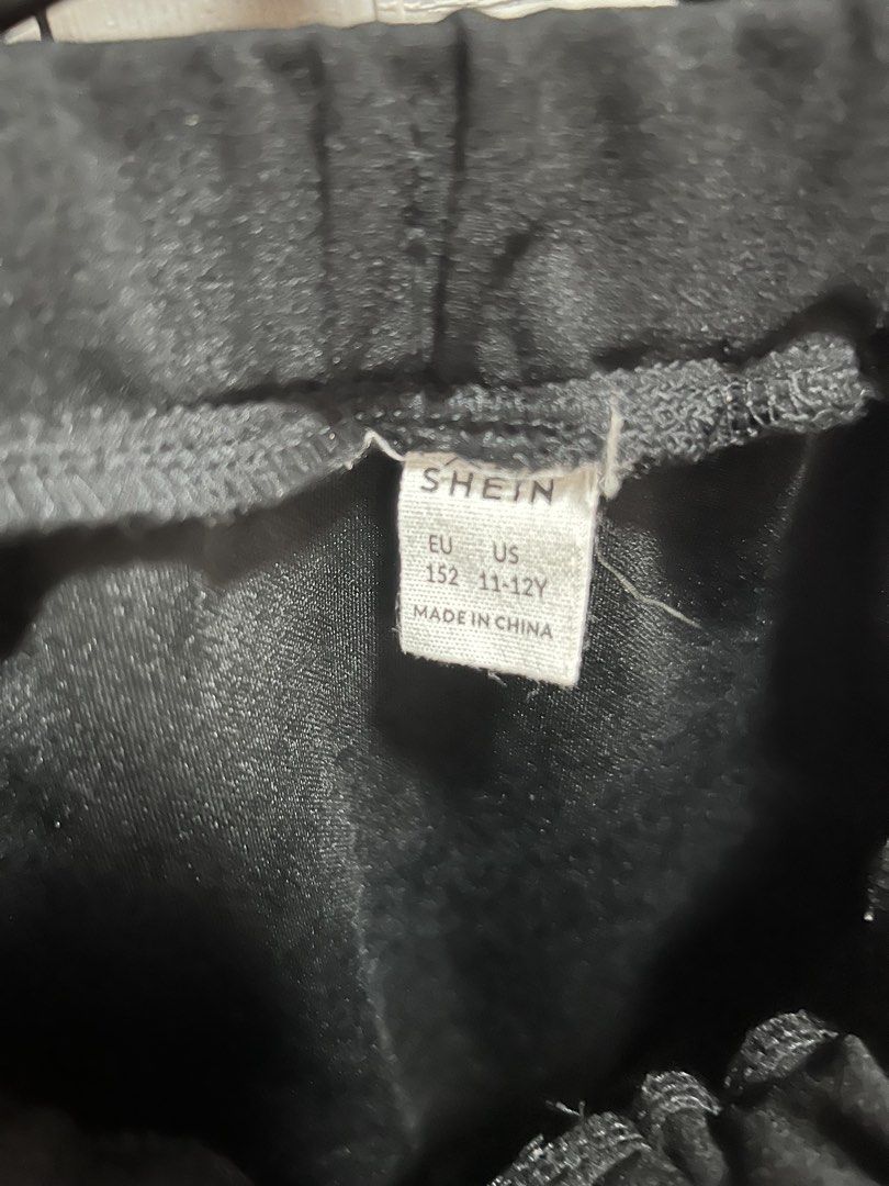 SHEIN Black Button-Front Skirt 11-12Y (Category: Babies & Kids Fashion) located in Cainta. Submitted by p3spreloved (Listing ID 1445999169, Image 2). Description: - Black A-line skirt from SHEIN - Comfortable elastic waistband - Stylish button-front detail - Versatile for casual or dressed-up outfits - Easy to pair with various tops - Size: 11-12 Years Length 15in Waist when laid flat 11in but still stretchable upto 14in so it fits 28in waist.