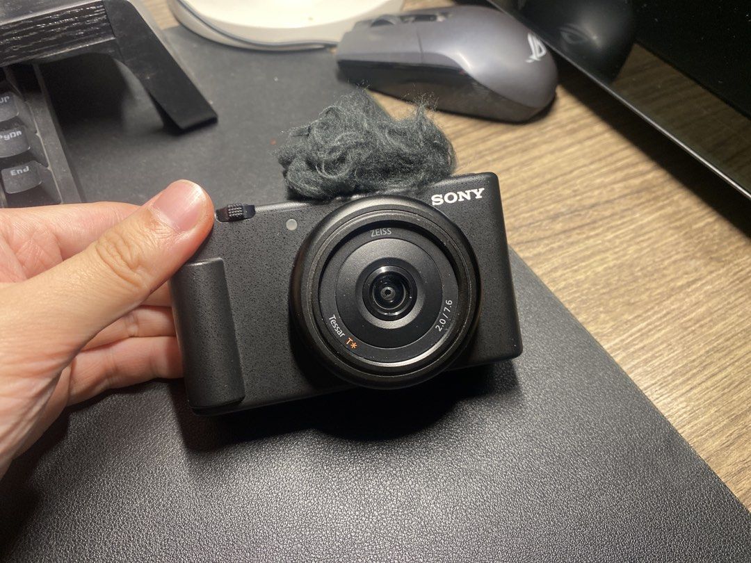 Sony ZV-1F Digital Camera with Microphone Windscreen (Category: Cameras) located in Naga. Submitted by iamspeed (Listing ID 1446142465, Image 2). Description: - Sony ZV-1Fcamera, ideal for vlogging & content creation. - Comes with a furry windscreen for enhanced audio. - Features a flip screen for effortless shot framing. - Compact and portable design for on-the-go use. - Ready to elevate your next project!.