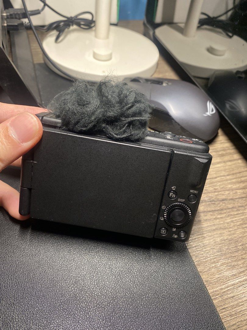 Sony ZV-1F Digital Camera with Microphone Windscreen (Category: Cameras) located in Naga. Submitted by iamspeed (Listing ID 1446142465, Image 3). Description: - Sony ZV-1Fcamera, ideal for vlogging & content creation. - Comes with a furry windscreen for enhanced audio. - Features a flip screen for effortless shot framing. - Compact and portable design for on-the-go use. - Ready to elevate your next project!.