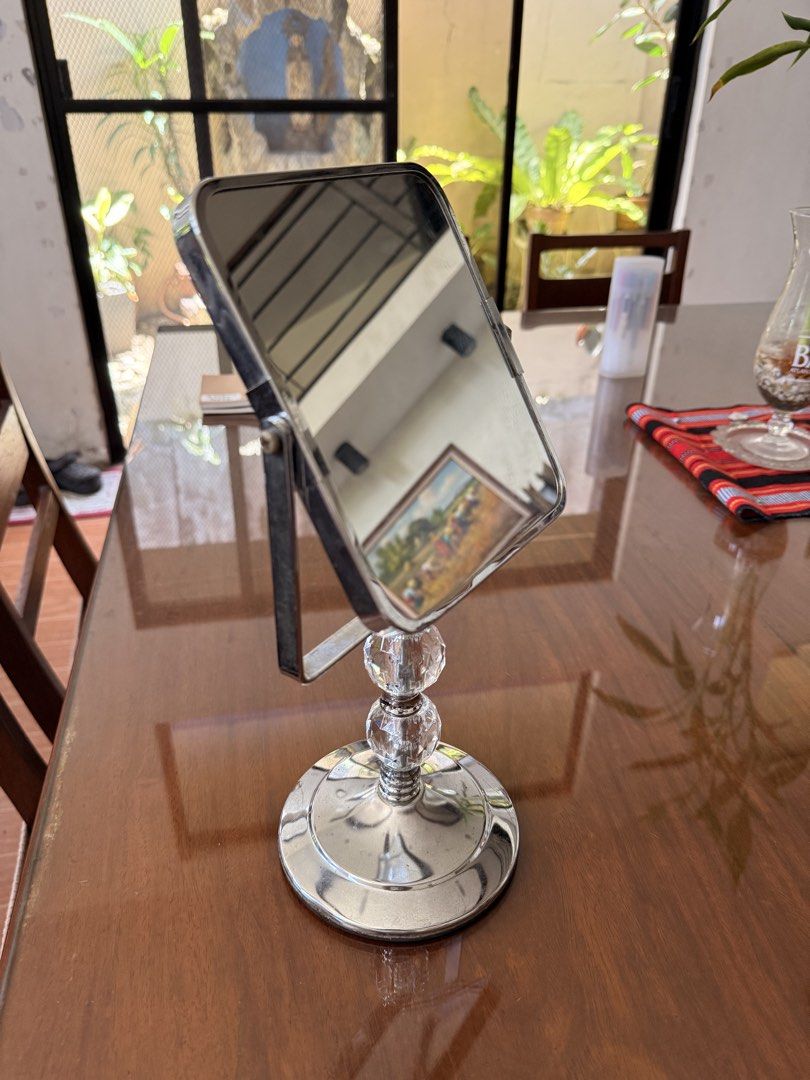 Square Tabletop Mirror with Crystal Base (Category: Mirrors) located in Caloocan City. Submitted by juanpaoloi59703 (Listing ID 1446075775, Image 1). Description: - Square mirror on a stand - Shiny chrome base with clear crystal accents - Adjustable tilt feature - Ideal size for vanity or desk - Minor smudges on mirror surface - Great for makeup application or decorative display.