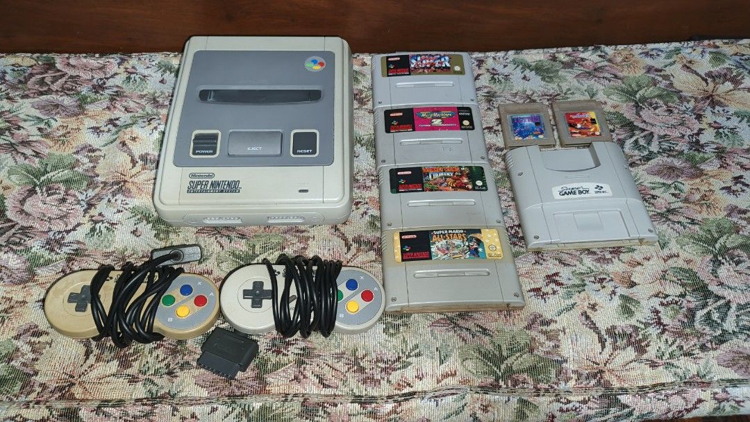 Super Nintendo Entertainment System SNES PAL version (Category: Nintendo) located in Las Pinas. Submitted by filipsnew_2001 (Listing ID 1446066484, Image 1). Description: Package Inclusions: - Super Nintendo (SNES) PAL version unit - 220v power supply - Original nintendo AV cable - 2 controllers - Replaced capacitors last March 2024 Game Cartridges: -Super mario all stars -Donkey kong country -Super street fighter 2 - Micromachines -Super game bo
