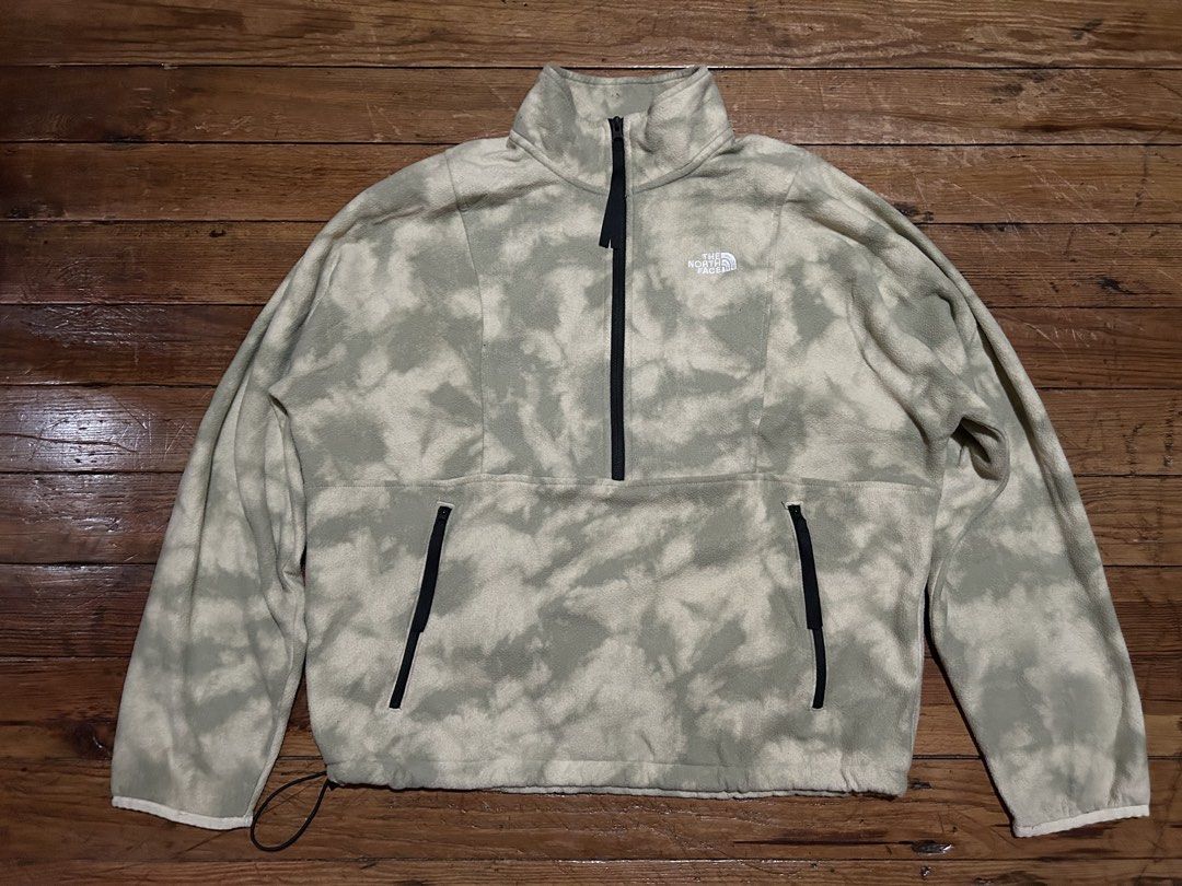 The North Face Tie-Dye Fleece Half-Zip Jacket (Category: Coats, Jackets and Outerwear) located in Baguio. Submitted by don_ben (Listing ID 1446123600, Image 1). Description: - The North Face Fleece Jacket - Unique green and beige tie-dye pattern - Half-zip closure with stand-up collar - Kangaroo pocket with side zip closures - Adjustable drawstring hem - Size: Large (L) - Dimensions: 25 x 25.