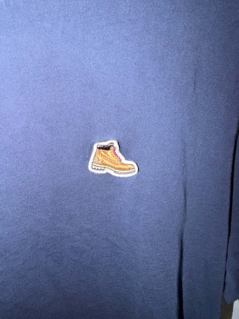 Timberland Navy Blue T-Shirt with Boot Logo (Category: Tshirts & Polo Shirts ) located in Tagudin. Submitted by 77sleep (Listing ID 1446079964, Image 2). Description: - Navy blue Timberland t-shirt - Made from 100% cotton - Classic Timberland boot logo embroidered on the chest - Small Timberland logo on the sleeve - Perfect for comfortable and casual wear 20x27.5.
