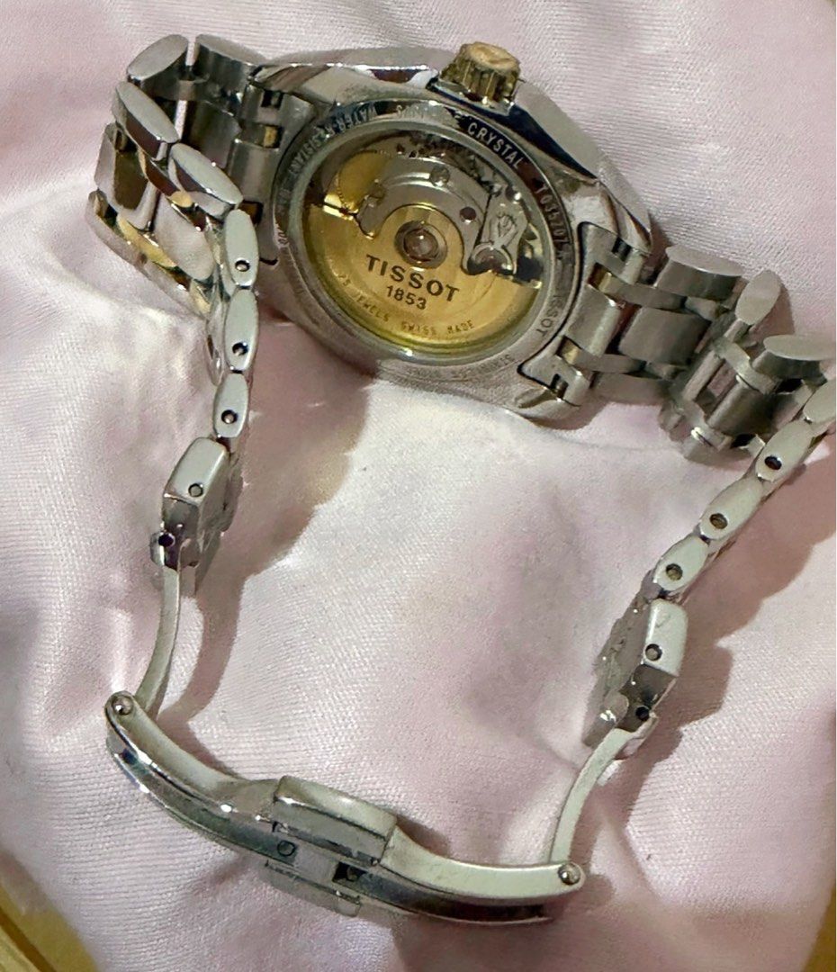 Tissot 1853 Automatic Two-Tone Watch (Category: Luxury Watches) located in Cagayan de Oro. Submitted by megflores413 (Listing ID 1445997021, Image 2). Description: - Tissot 1853 Automatic Watch - Classic white dial with date window - Stainless steel and gold-tone link bracelet - Exhibition case back showcasing automatic movement - Versatile for everyday wear or special events - In excellent working condition - Signs of wear - Watch only.