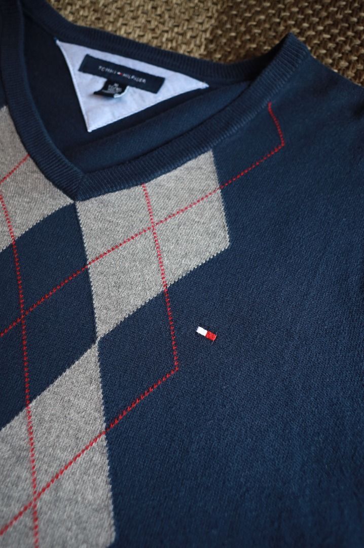 Tommy Hilfiger Argyle Knitted V-Neck Sweater (Category: Coats, Jackets and Outerwear) located in Pasig City. Submitted by mlclmchrs (Listing ID 1446155484, Image 2). Description: Sizing: XL on tag Width - 22.5 inches Length - 29.5 inches Sleeve Length - 22 inches NO ISSUES.