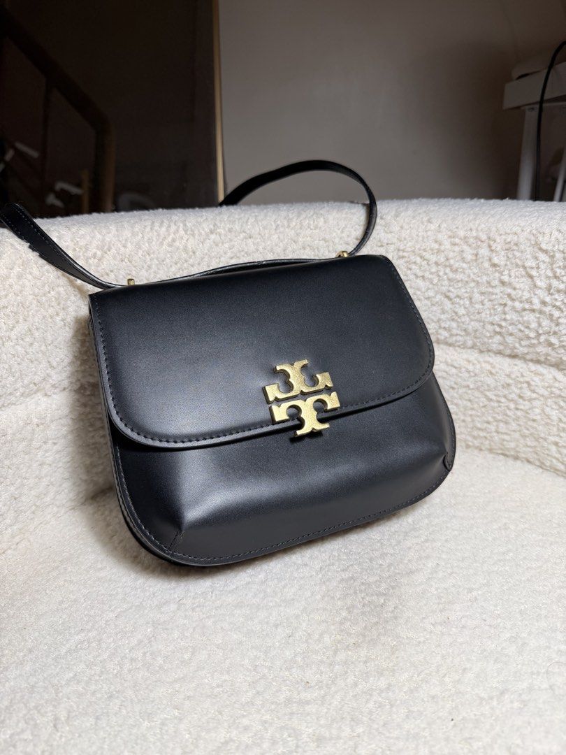Tory Burch Eleanor Slim Saddle in Black (Category: Shoulder Bags) located in Manila. Submitted by pinkkitkat (Listing ID 1446142610, Image 1). Description: Elegant and timeless everyday piece ✨ Easy to style and still looks beautiful worn. Condition: Fair | Please check photos carefully for actual condition. Disclaimer: Received as a gift, so authenticity is not guaranteed. Please buy only if comfortable and manage expectations accordingly. ✔️ La
