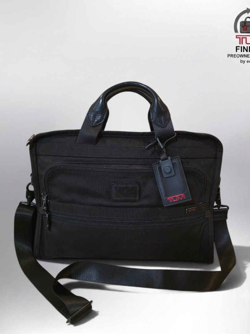 Tumi Black Nylon Briefcase Laptop Bag (Category: Briefcases) located in Cabuyao City. Submitted by swiftdeer.ed9787 (Listing ID 1446014578, Image 1). Description: for sale Authentic preowned price: 6500 Location: Cabuyao Lagina Condition: used in perfect condition - Brand: Tumi - Color: Black - Material: Durable Nylon - Features: Top handles, detachable shoulder strap - Organization: Multiple zippered compartments - Capacity: Ample space for lapt