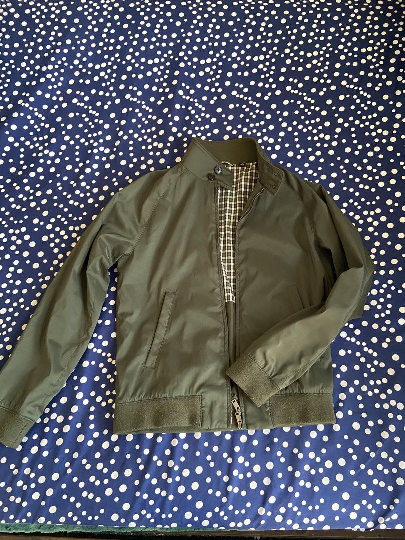 Uniqlo Harrington Jacket Olive Green Size S (Category: Coats, Jackets and Outerwear) located in Manila. Submitted by wanderboy_01 (Listing ID 1445987871, Image 1). Description: - Uniqlo Harrington Jacket - Color: Olive Green - Size: S - Classic checkered lining - Ribbed cuffs and collar - Zip-up front with button closure at the neck - Ideal for layering - Versatile for casual and smart-casual outfits.