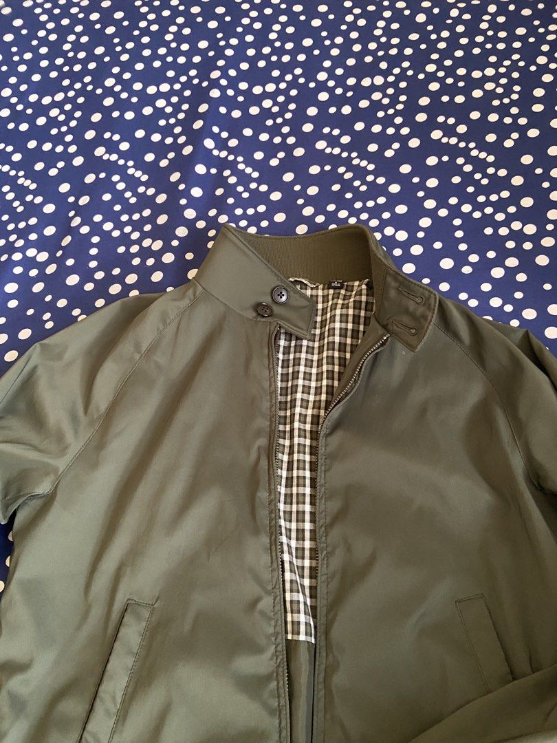 Uniqlo Harrington Jacket Olive Green Size S (Category: Coats, Jackets and Outerwear) located in Manila. Submitted by wanderboy_01 (Listing ID 1445987871, Image 2). Description: - Uniqlo Harrington Jacket - Color: Olive Green - Size: S - Classic checkered lining - Ribbed cuffs and collar - Zip-up front with button closure at the neck - Ideal for layering - Versatile for casual and smart-casual outfits.