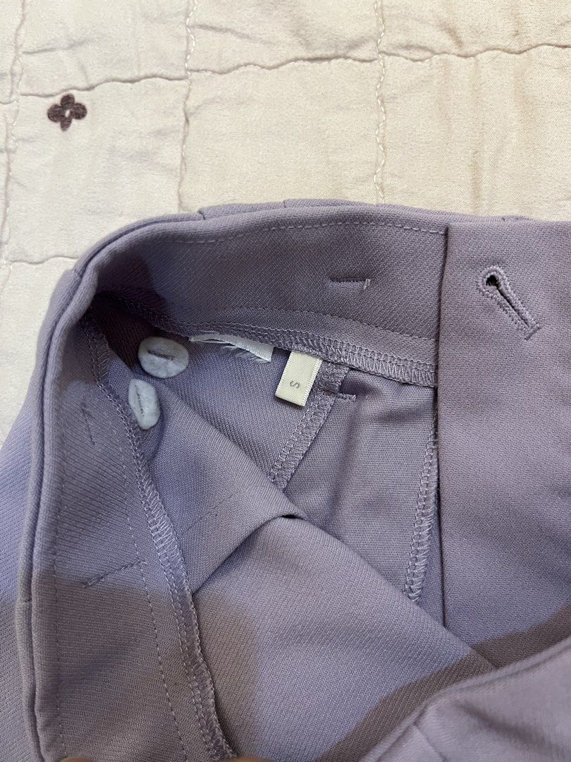 Uniqlo Light Purple High-Waisted Slacks (Category: Other Bottoms) located in San Juan City. Submitted by thrift.closet (Listing ID 1446093586, Image 3). Description: - Light purple tailored pants - High-waisted fit - Front pleats - Double button waist closure - Size S - cut tag.