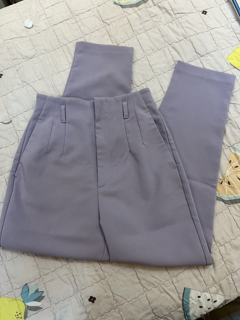 Uniqlo Light Purple High-Waisted Slacks (Category: Other Bottoms) located in San Juan City. Submitted by thrift.closet (Listing ID 1446093586, Image 1). Description: - Light purple tailored pants - High-waisted fit - Front pleats - Double button waist closure - Size S - cut tag.