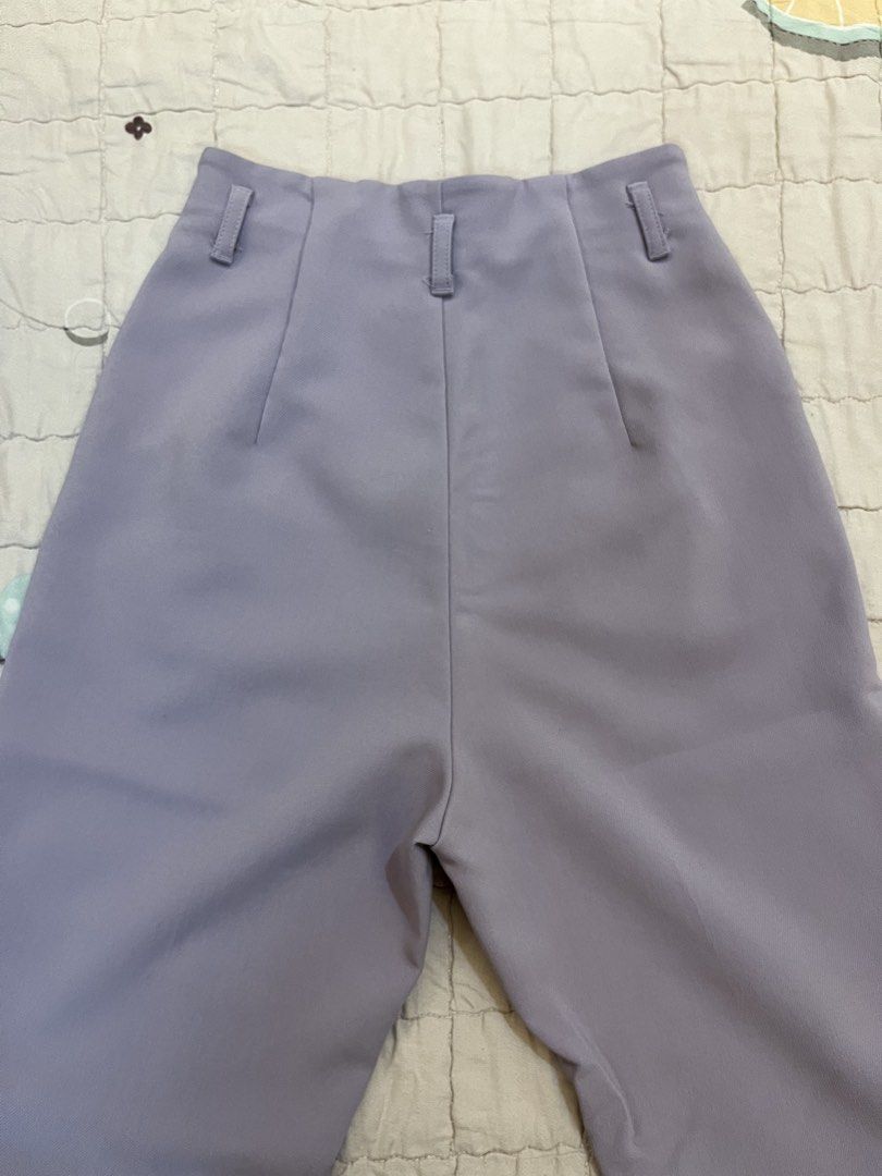 Uniqlo Light Purple High-Waisted Slacks (Category: Other Bottoms) located in San Juan City. Submitted by thrift.closet (Listing ID 1446093586, Image 2). Description: - Light purple tailored pants - High-waisted fit - Front pleats - Double button waist closure - Size S - cut tag.