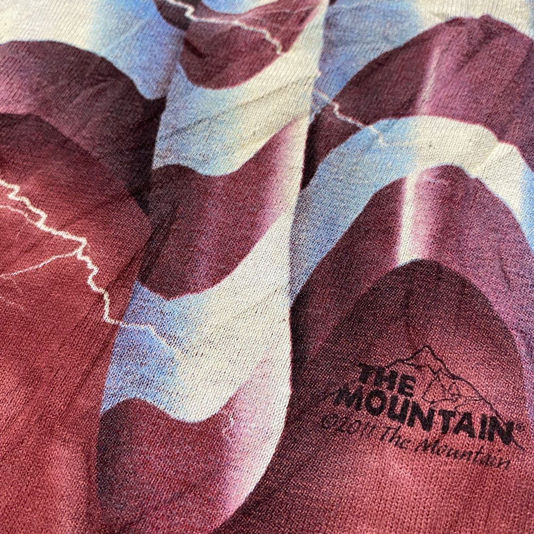 Vintage The Mountain USA Flag Lightning (Category: Tshirts & Polo Shirts ) located in Imus. Submitted by fndsvntg_307 (Listing ID 1446022560, Image 3). Description: - The Mountain 2011 - Size: XL - Design: American flag with lightning - Effect: Red tie-dye - Material: Gildan Heavy Cotton - Occasion: Patriotic events, bold casual wear.