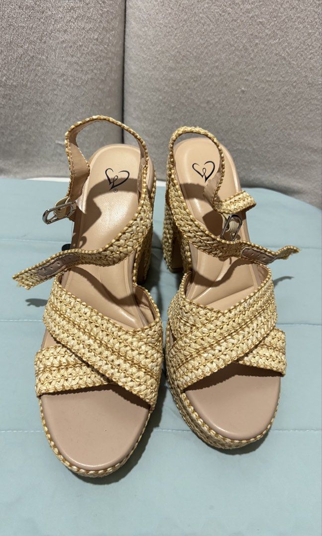 Wedge Sandals / Wedge heels / Beige heels (Category: Wedges) located in Quezon City. Submitted by gcc216 (Listing ID 1446036270, Image 1). Description: - High wedge sandals from Windsor store , Sacramento - Woven straw-like texture on platform and straps. - Straps cross over the foot with an adjustable buckle. - 'Luxe Fit Plush Support Foam' insole for comfort. - Perfect for any outfit. - Bought this in the US and never used it. - Size: 8 1/2 .