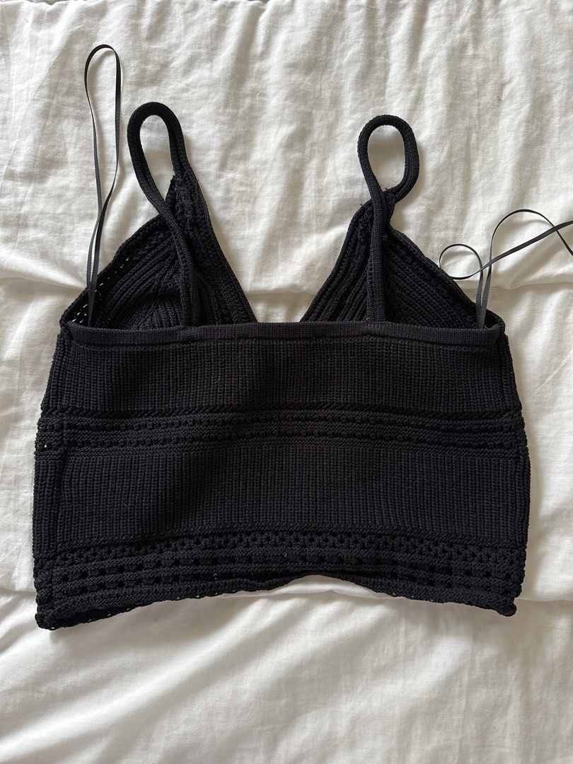 Zara Black Knit Button-Up Crop Top Size S (Category: Others Tops) located in Manila. Submitted by rhaphina (Listing ID 1446058941, Image 3). Description: - Zara black knit crop top - V-neckline with button-up front - Strappy design - Crochet-like detail along the hem - Size S - Perfect with high-waisted jeans or skirts.
