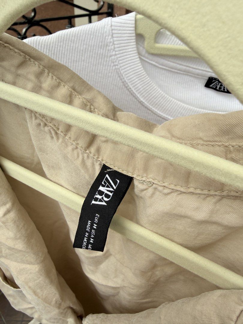 Zara Tops S-M (Category: Blouses) located in Davao. Submitted by keirousel (Listing ID 1446032853, Image 3). Description: - Take all 3 Zara tops - First top: Beige cropped shirt with collar and button front. - Second top: White ribbed top with cute ruffle sleeves. - Third top: Blouse with floral sleeve details.