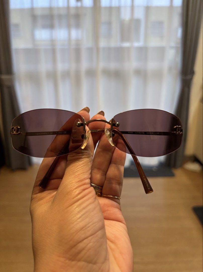 💯 ORIGINAL Chanel Rimless Sunglasses with Case (Category: Sunglasses & Eyewear) located in Marilao. Submitted by 12forkeeps (Listing ID 1446262211, Image 1). Description: - Authentic Chanel rimless sunglasses - Elegant gold frame with tinted lenses - Comes with original Chanel case and cleaning cloth - Made in Italy - Model number: 4002 C.116/75 54019 130 - Perfect for everyday style.