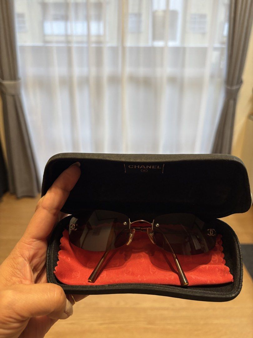 💯 ORIGINAL Chanel Rimless Sunglasses with Case (Category: Sunglasses & Eyewear) located in Marilao. Submitted by 12forkeeps (Listing ID 1446262211, Image 2). Description: - Authentic Chanel rimless sunglasses - Elegant gold frame with tinted lenses - Comes with original Chanel case and cleaning cloth - Made in Italy - Model number: 4002 C.116/75 54019 130 - Perfect for everyday style.