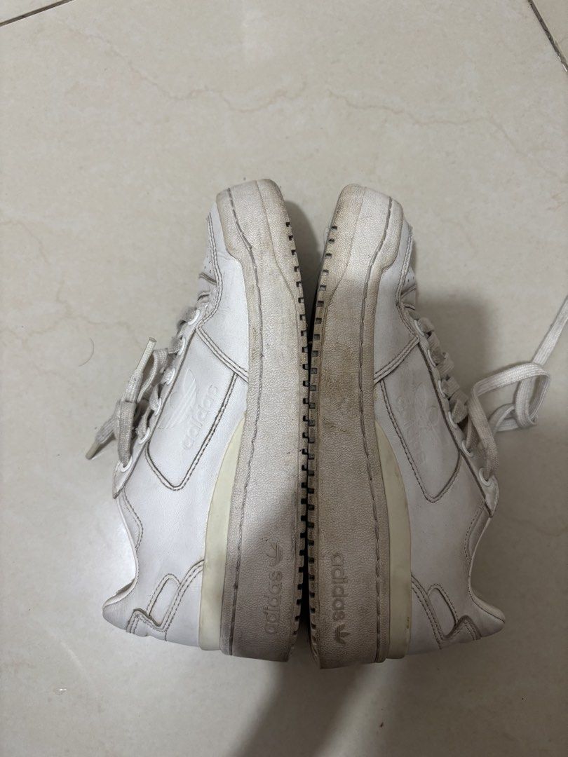 Adidas Forum Bold White Sneakers (Category: Sneakers) located in Manila. Submitted by declutterwithbeyuh (Listing ID 1446173009, Image 2). Description: - White Adidas Forum Low sneakers - Classic low-top design - Shows some signs of wear on soles and leather - Laces are a bit dirty - Still has plenty of life left for casual wear.