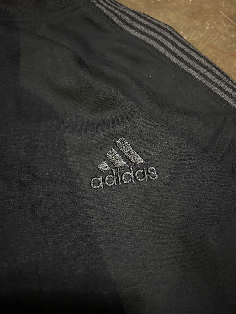 Adidas Track Jacket 2XL Black 3 Stripes (Category: Coats, Jackets and Outerwear) located in Malabon City. Submitted by yivsthrift (Listing ID 1446205733, Image 2). Description: - Classic black Adidas track jacket - Size: 2XL - Iconic 3 stripes on sleeves - Embroidered Adidas logo on chest - Small Adidas tag near hem - Full zip closure - Made in Turkey - Dimes 27 x 23.
