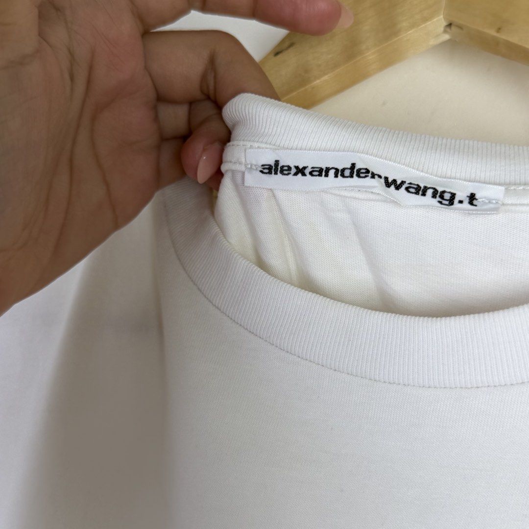 Alexander Wang White Logo T-Shirt (Category: Shirts) located in Calasiao. Submitted by liascorner (Listing ID 1446308190, Image 3). Description: S-M W:17.5 L:25.5 9.5/10.