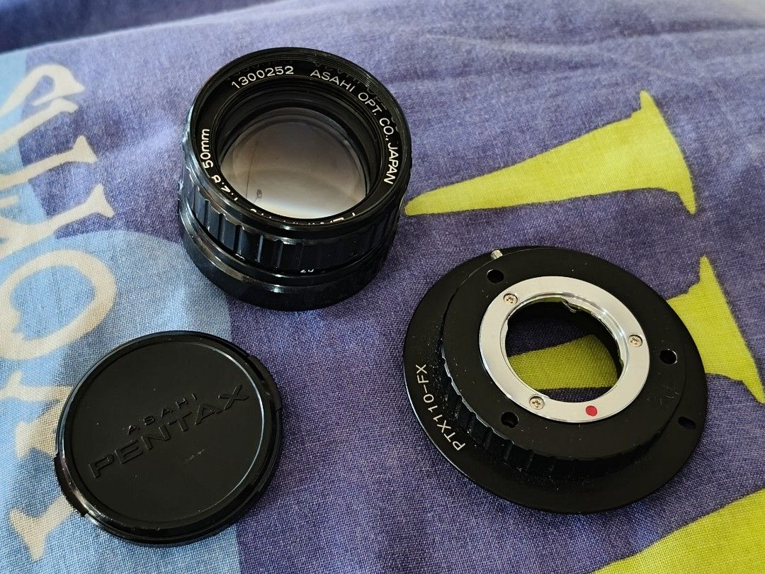 Asahi Pentax 110 to FX Lens Adapter (Category: Lens & Kits) located in Quezon City. Submitted by meistervelli (Listing ID 1446254203, Image 1). Description: - Asahi Pentax 110 Lens - Focal Length: 50mm - Aperture: f/2.8 - Includes PTX110-FX Adapter - Adapter allows mounting on Fujifilm X-mount cameras - Lens cap included - Ideal for vintage lens enthusiasts.