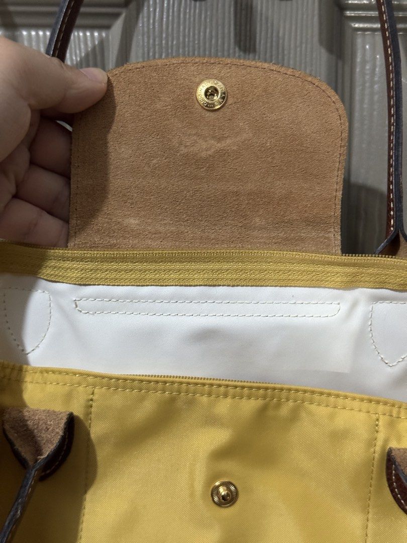 Authentic LONGCHAMP Le Pliage Original Shoulder Bag Small - Yellow (Category: Luxury Bags & Wallets) located in Quezon City. Submitted by afpar (Listing ID 1446244403, Image 3). Description: - Yellow Longchamp tote bag - Genuine leather handles and trim - Secure zipper closure with snap button flap - Interior zippered pocket for essentials - Ideal for everyday use with generous storage capacity.