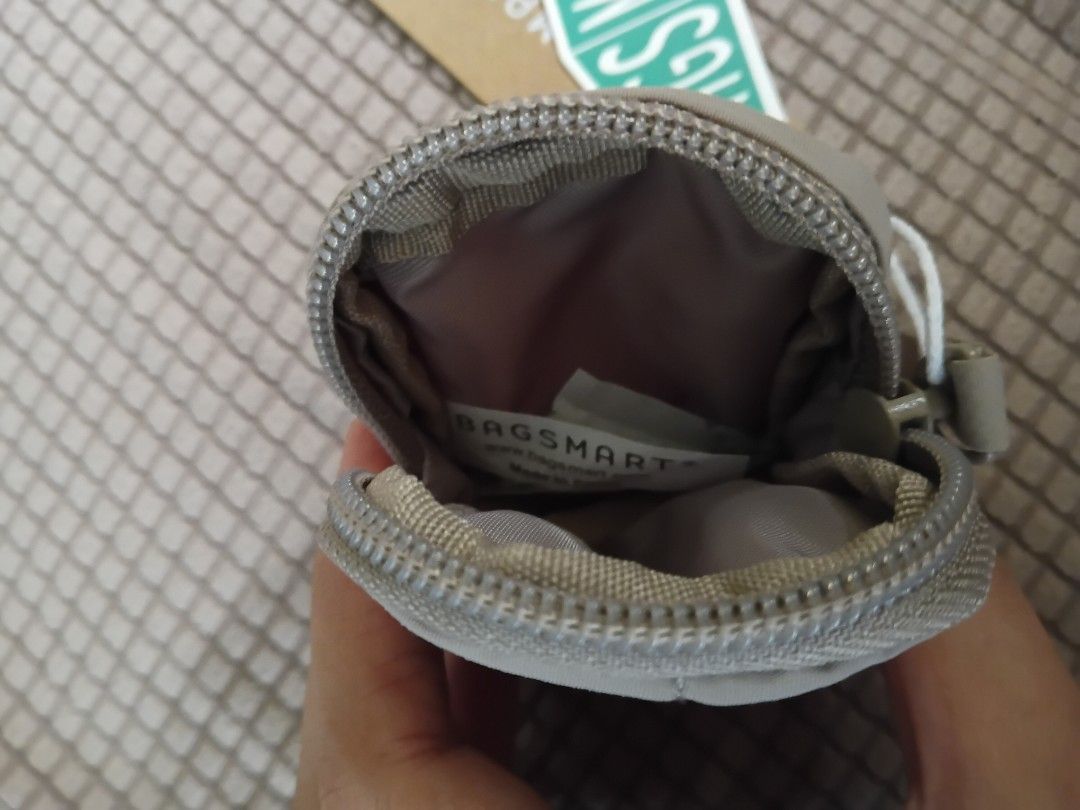 BAGSMART Quilted mini Pouch (Category: Purses & Pouches) located in Cagayan de Oro. Submitted by authenticstuffsdecluttering (Listing ID 1446219083, Image 3). Description: - Brand: BAGSMART - Style: Small quilted pouch - Color: Tan - Closure: Zipper - Features: Wrist strap - Perfect for: Organizing small items like coins, earbuds - Condition: New with original tags attached.