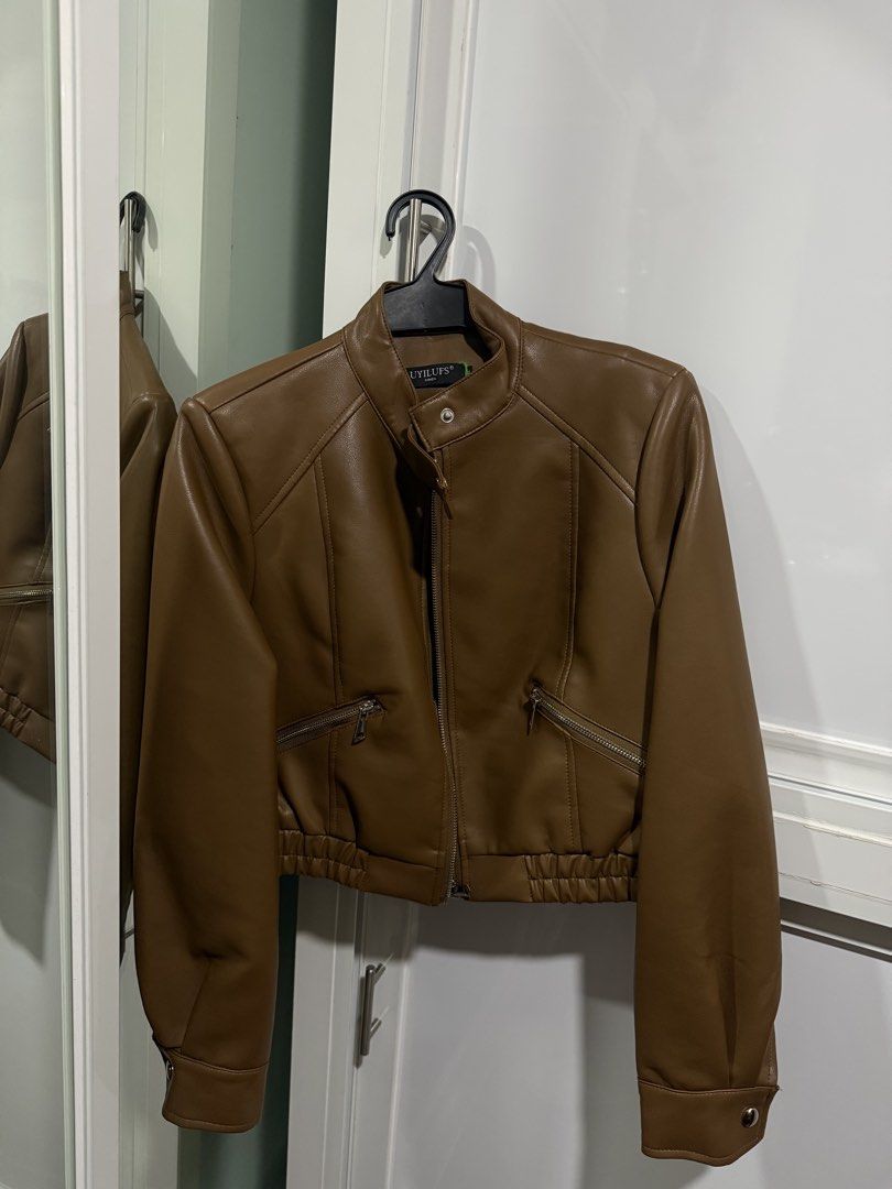 BKK Brown Leather Jacket (Category: Coats, Jackets and Outerwear) located in Pasay City. Submitted by andreaflo (Listing ID 1446200683, Image 1). Description: 🍂 brown leather jacket bought from BKK 🤎 best fits M–L; loose/oversized on S frames 🤎 used ONLY once for travel; GOOD AS BRAND NEW (already dry cleaned) 🍂 zip-up front closure 🍂 zippered pockets for essentials 🍂 button detail at the collar 🤎 ideal for layering over outfits 🏷️ Php180