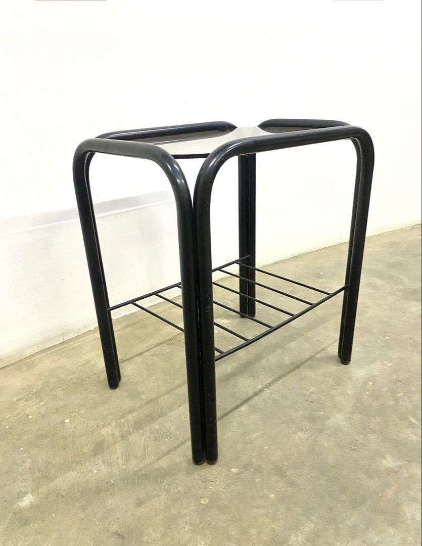 Black Metal and Glass Side Table with Lower Shelf (Category: Tables & Sets) located in Santa Rosa. Submitted by annie_annie83 (Listing ID 1446215838, Image 2). Description: - Sleek black metal frame with elegant curved design. - Durable glass top for a modern look. - Convenient lower shelf for added storage space. - Versatile use: ideal as a bedside table or a chic accent piece..