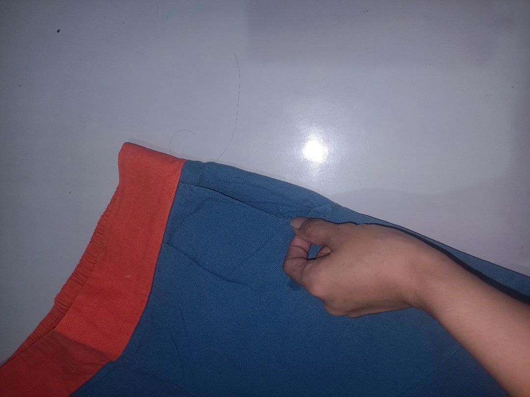 Blue Pants with Orange Waistband (Category: Other Bottoms) located in Las Pinas. Submitted by ZHOEYCLOTHING (Listing ID 1446297431, Image 3). Description: - Stylish blue wide-leg pants - Features a contrasting orange elastic waistband - Ideal for everyday casual wear.