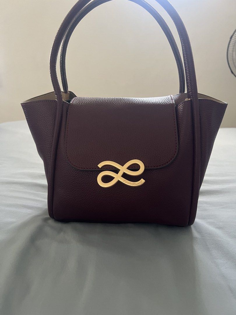 HOLB (Destiny) (Category: Luxury Bags & Wallets) located in Lucena. Submitted by ishasanjuan (Listing ID 1446206608, Image 1). Description: - burgundy - not aunthentic HOLB - Gold infinity logo on the front flap - with strap - Never been used -RFs: too many bags.