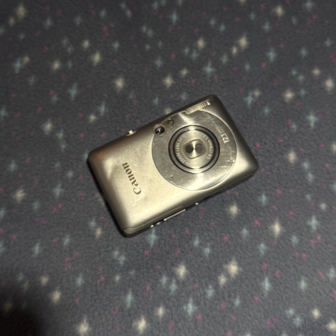Canon IXUS DIGITAL 210 IS Silver Digital Camera (Category: Cameras) located in Quezon City. Submitted by ncstbr367 (Listing ID 1446317357, Image 1). Description: 📸 Canon IXUS DIGITAL 210 IS (Silver) ✨ Features: Compact point-and-shoot digital camera Stylish silver finish Great for collectors, repair projects, or parts Comes with original battery and charger ⚠️ Please read before buying (Issues): Minor scuffs on the body and screen Dent on the fr