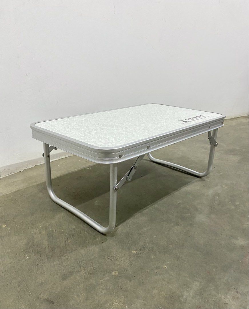 Captain Stag Folding Table Portable Laptop Desk (Category: Tables & Sets) located in Santa Rosa. Submitted by annie_annie83 (Listing ID 1446215908, Image 2). Description: - Captain Stag portable folding table - Ideal for camping or home use - Legs fold flat for convenient storage - Features a speckled surface pattern - Lightweight and easy to carry - Suitable for laptops or as a small dining table.