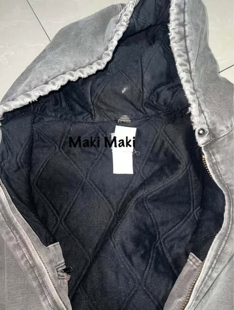 Carhartt Hooded Work Jacket Heavy Duty (Category: Coats, Jackets and Outerwear) located in Caloocan City. Submitted by da_decluttering_thrifty (Listing ID 1446256140, Image 3). Description: - Classic Carhartt work jacket - Grey wash canvas exterior - Warm black quilted lining - Attached hood - Zipper front closure - Ribbed cuffs and hem for a snug fit - Built for durability and long-lasting wear - Perfect for work or everyday casual style - Negot