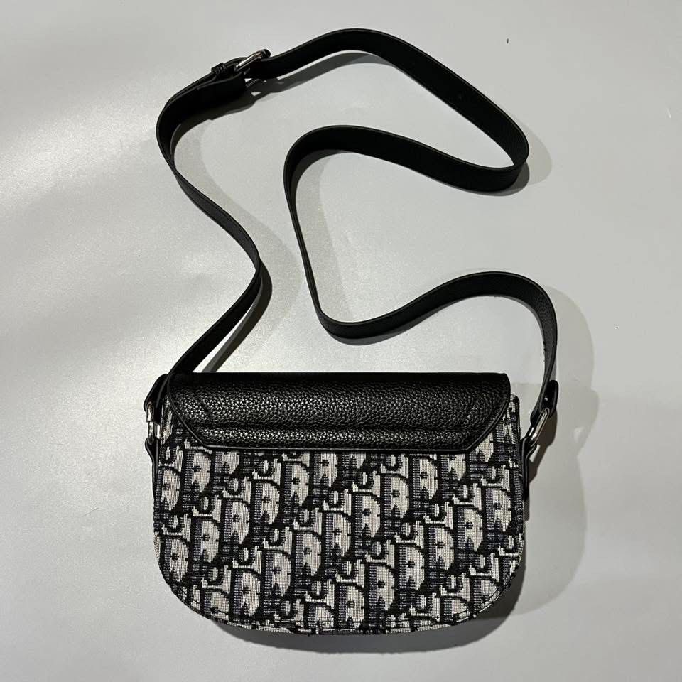 Christian Dior Mini Saddle Messenger Bag (Category: Luxury Bags & Wallets) located in Manila. Submitted by tepthirft (Listing ID 1446317048, Image 2). Description: Christian Dior Mini Saddle Messenger Bag excellent condition no issue.
