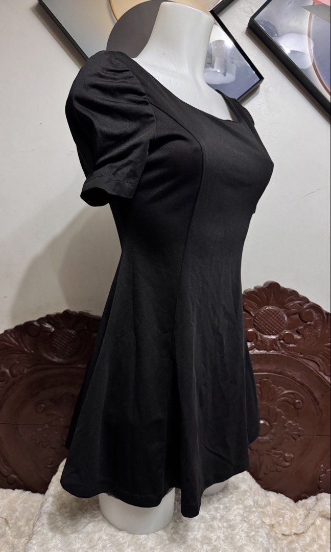 Classy Black Puff Sleeve Square Neck Mini Dress (Category: Dresses) located in Marikina City. Submitted by lorradel (Listing ID 1446253897, Image 2). Description: - length from shoulder 30in - Black mini dress - Puff sleeves - Square neckline - Flared skirt - Back zipper closure - Ideal for parties or a night out - Simple and chic design (magbase po sa size ng mannequin if it will fit you pati sa haba as you can see sa pic) - MAY HAVE some washab
