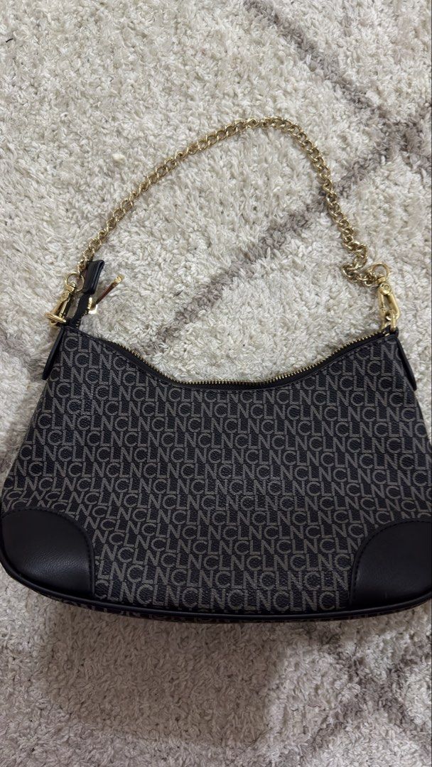 CLN Monogram Shoulder Bag with Gold Chain (Category: Luxury Bags & Wallets) located in Makati City. Submitted by jimmysellsph (Listing ID 1446276496, Image 2). Description: - Cute CLN shoulder bag - All-over monogram print - Gold chain strap - Patterned interior lining - Zipper closure - Ideal for everyday use or nights out.